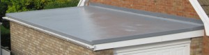project for flat roofing in manchester - image is a completed flat roof on shed adjacent to house